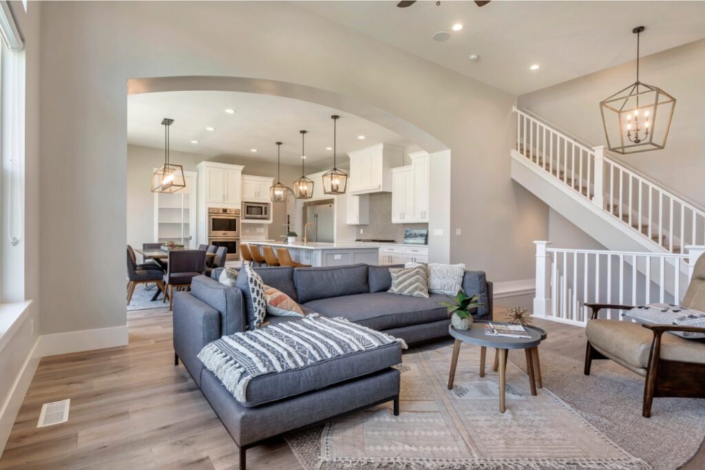 The room is a living space with furniture and chandeliers.